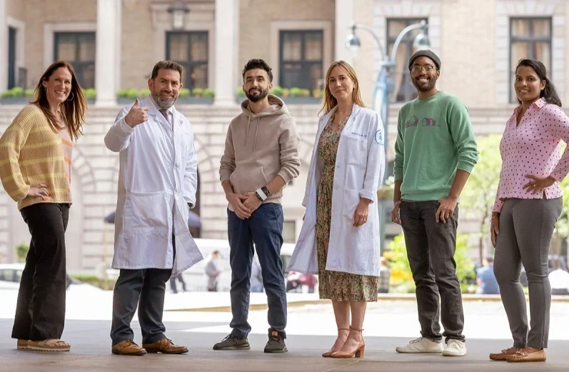 Four people who were successfully treated for rectal cancer in a clinical trial at Memorial Sloan Kettering. (Left to right) Sascha Roth, Dr. Luis Diaz, Imtiaz Hussain, Dr. Andrea Cercek, Avery Holmes and Nisha Varughese.