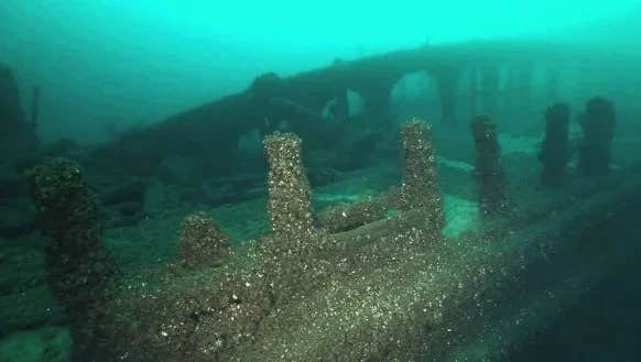 The clear, blue waters of Grand Traverse Bay have been a silent witness to centuries of maritime heritage and legend.