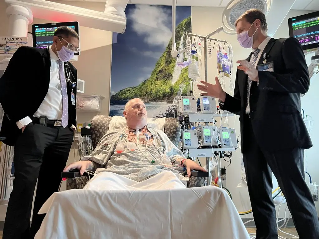 Dr. Girish Mour (L), Marty and Dr. Lott one week after the transplant