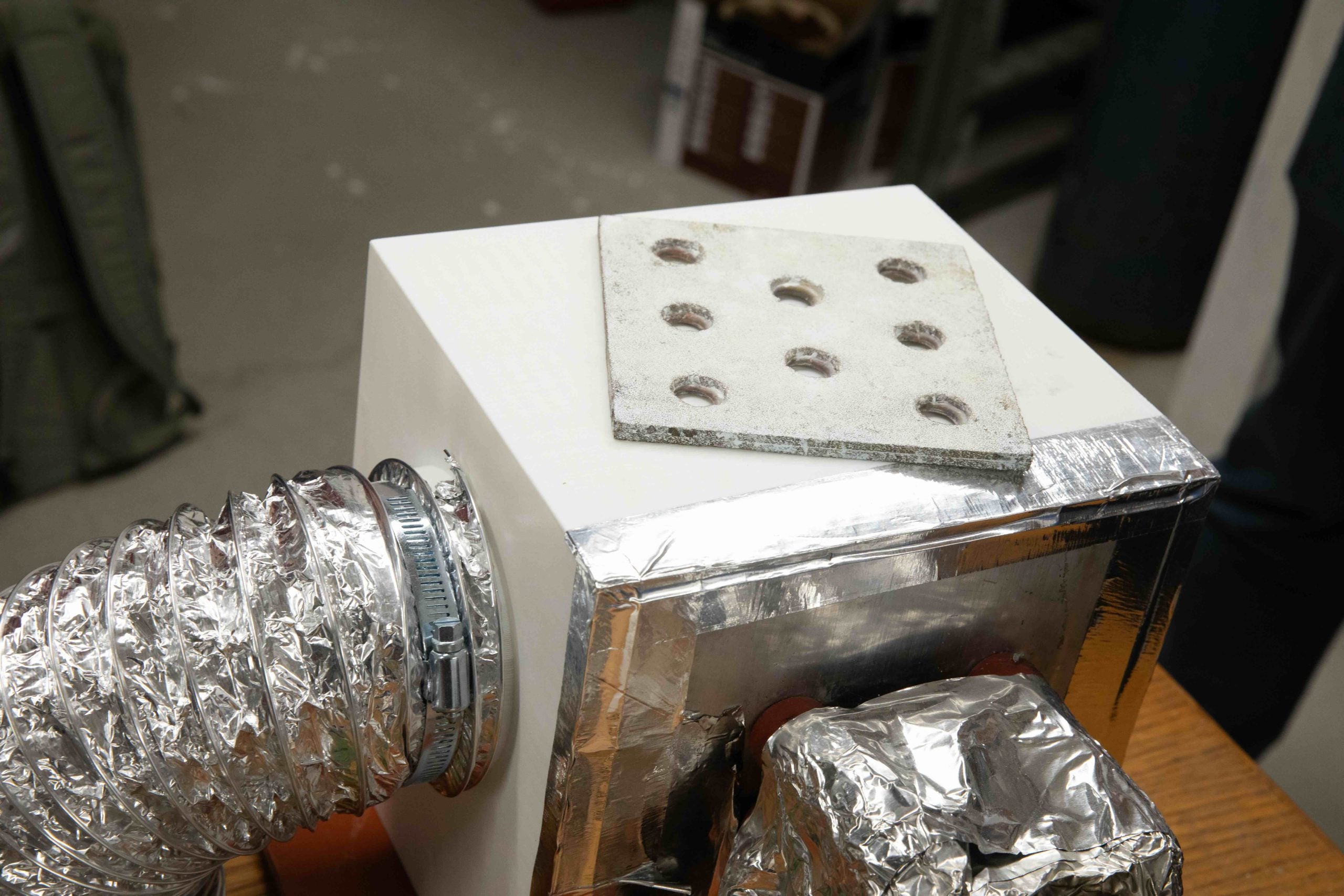 The device uses panels of adsorbent material made from aluminum fumarate to snag water molecules.