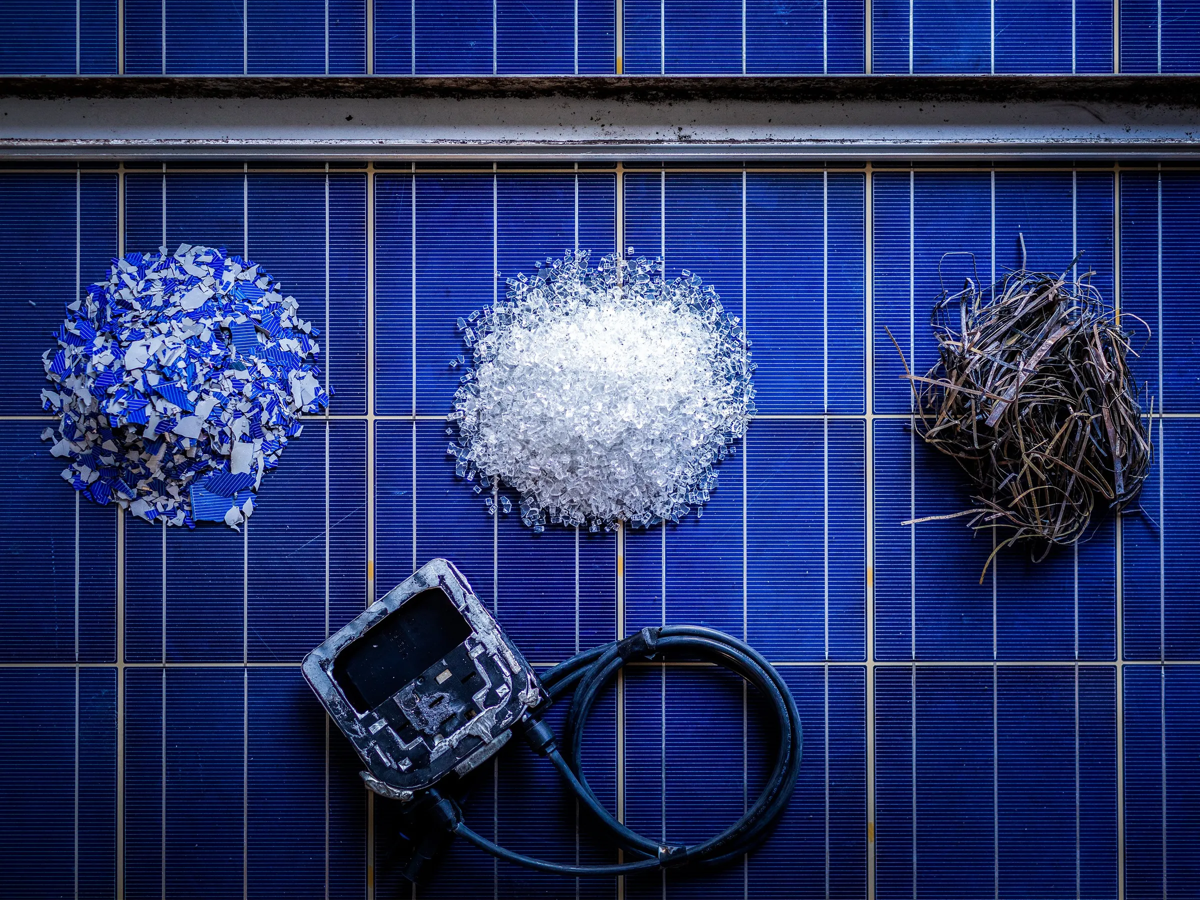 A solar panel broken down yields silicon, glass, copper, a junction box and an aluminum frame. 