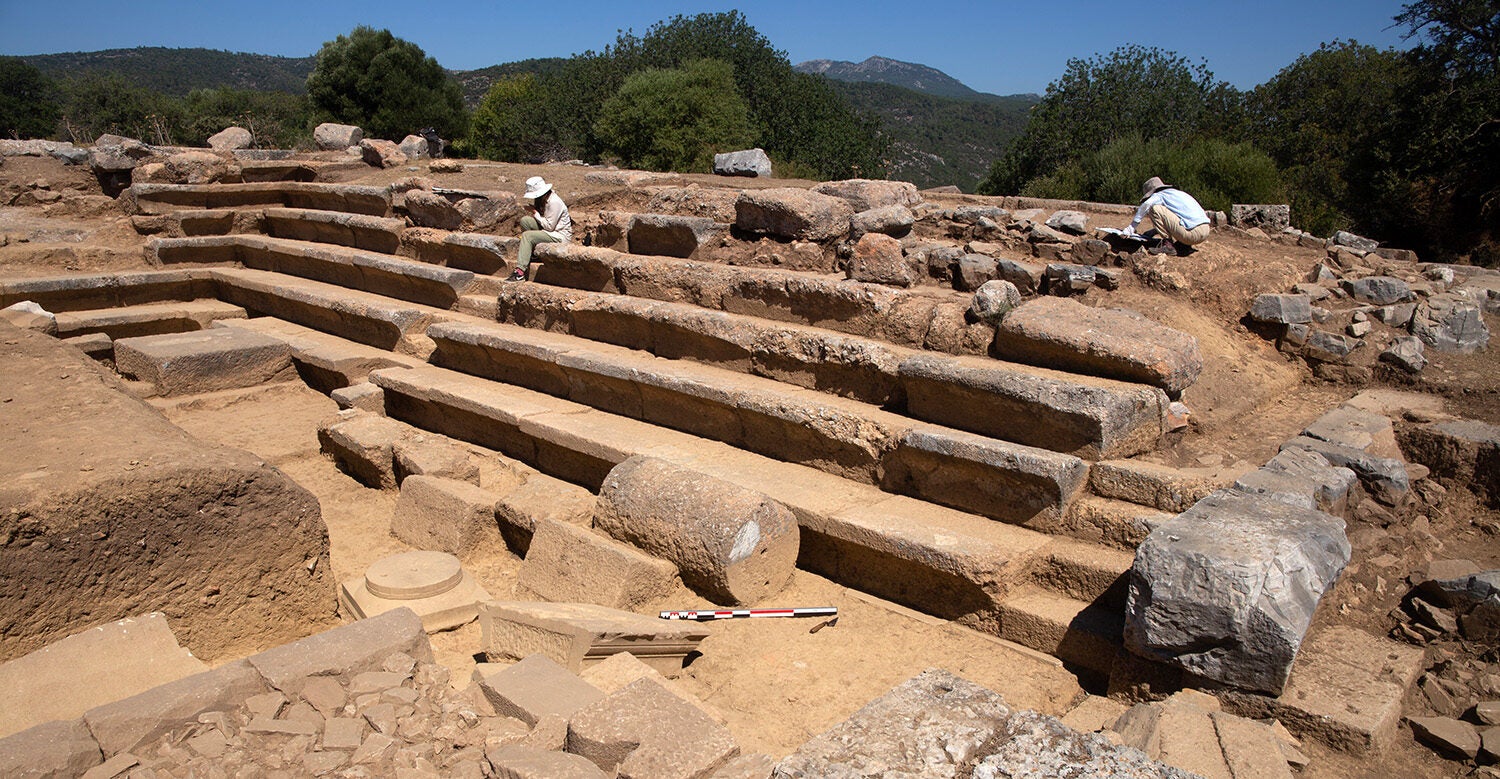 Architects Kübra Sağlam and Gizem Seymen working on architectural drawings of Bouleuterion, view looking northwest.