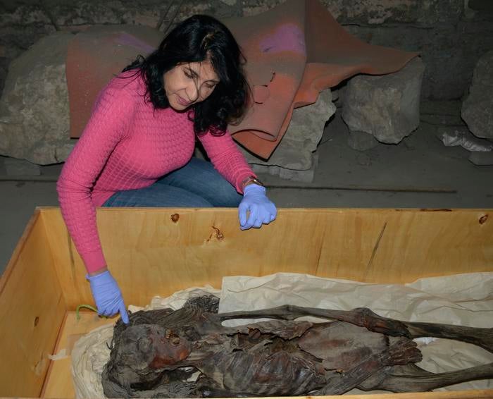 Prof Sahar Saleem with the Screaming Woman mummy

