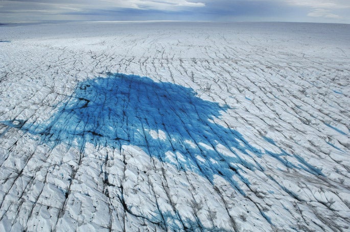Aerial view of a meltwater lake on the surface of the Greenland Ice Sheet 60 miles southeast of Illulissat, Greenland.
