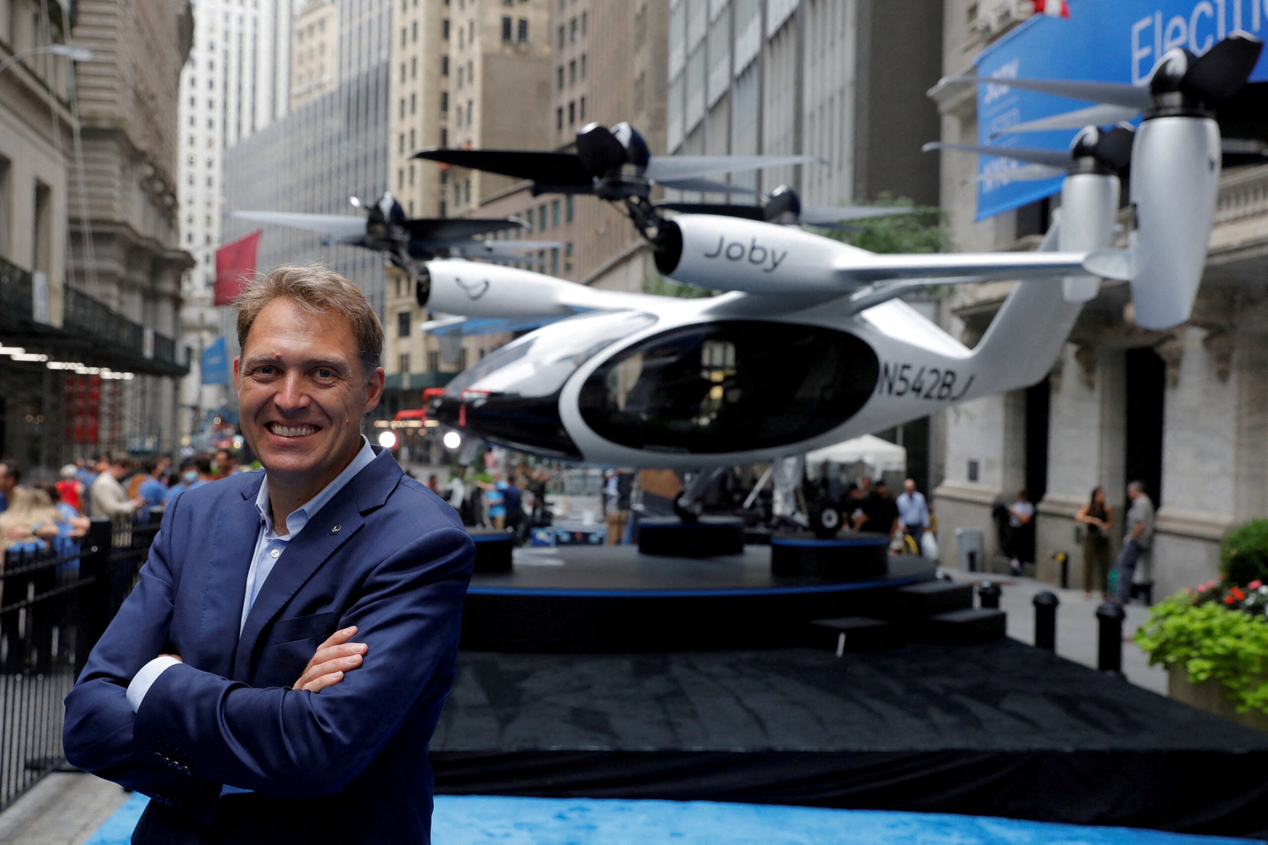 Joby Aviation founder JoeBen Bevirt poses next to a Joby Aviation Air Taxi in New York City. 