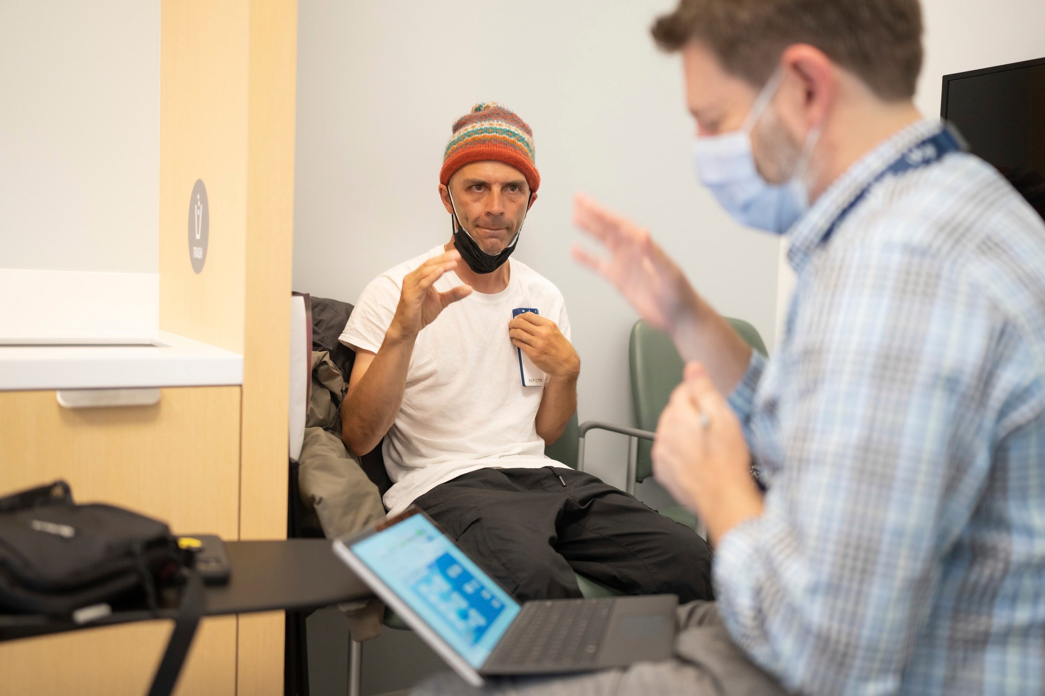 Shawn Connolly follows the directions of Dr. Nicholas B. Galifianakis, MD. while testing the DBS treatment.