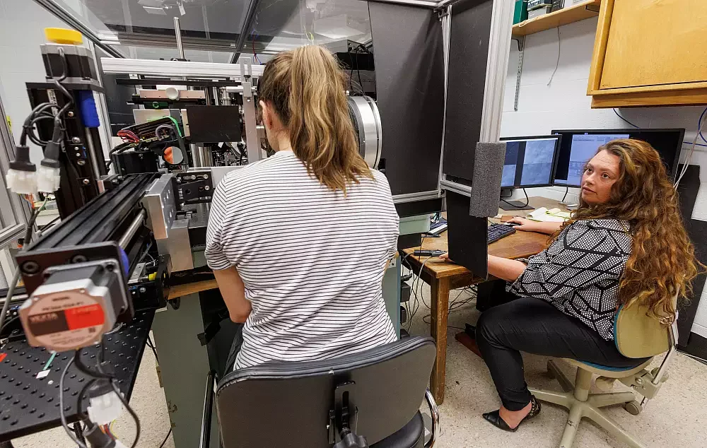 Sobczak participates in an eye scan conducted by clinical research assistant Brittany Walker in Burns' lab. 