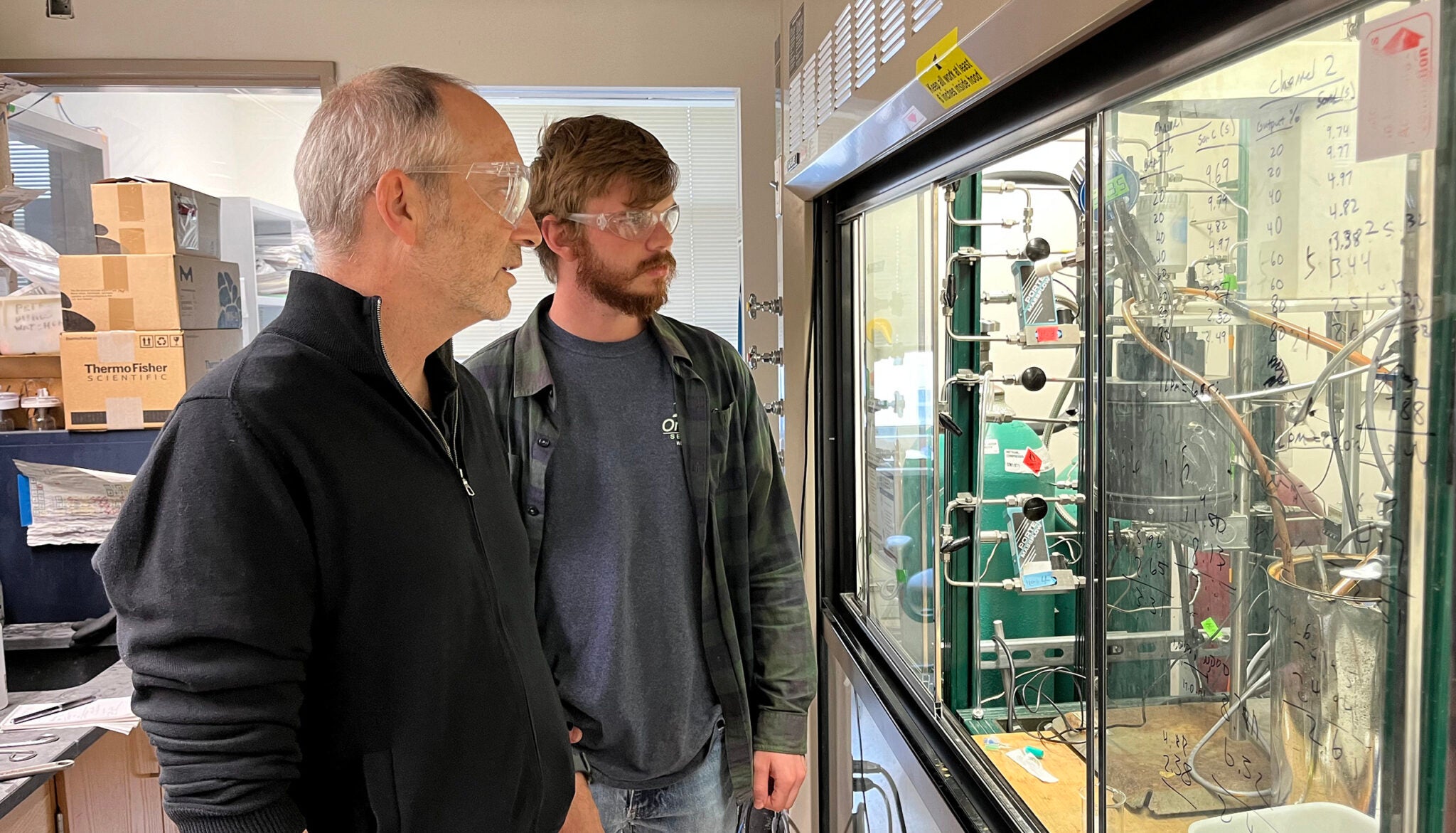Chemists John Hartwig and RJ Conk discuss the experimental apparatus that reduces plastics to their monomer precursors, which can then be used to make new plastics.
