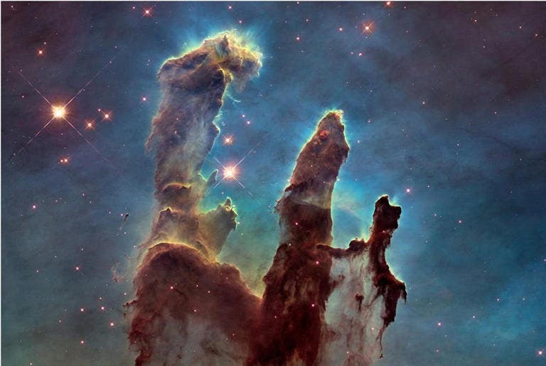 New research proposes a model that determines the universe’s age to be 26.7 billion years, which accounts for the James Webb Space Telescope’s "impossible early galaxy" observations. The telescope captured this Pillars of Creation image last year. New research proposes a model that determines the universe’s age to be 26.7 billion years, which accounts for the James Webb Space Telescope’s "impossible early galaxy" observations. The telescope captured this Pillars of Creation image last year.