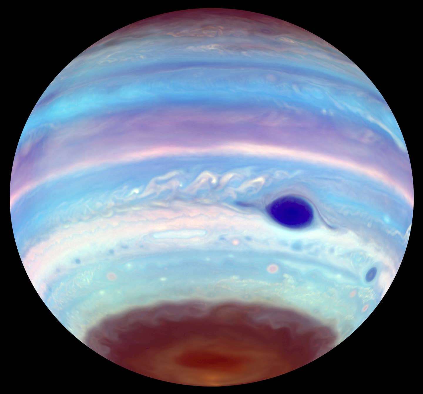 Magnetic tornadoes are stirring up Earth-size clouds of haze on Jupiter ...