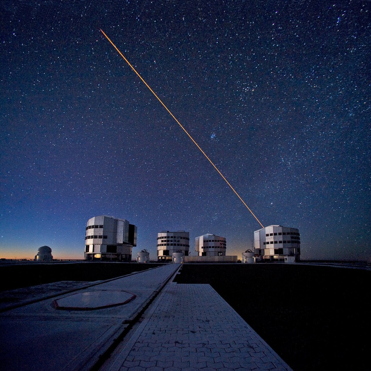The ESO Very Large Telescope (VLT) during observations. In this picture, taken from the VLT platform looking north-northwest at twilight, the four 8.2-metre Unit Telescopes (UTs) are visible.