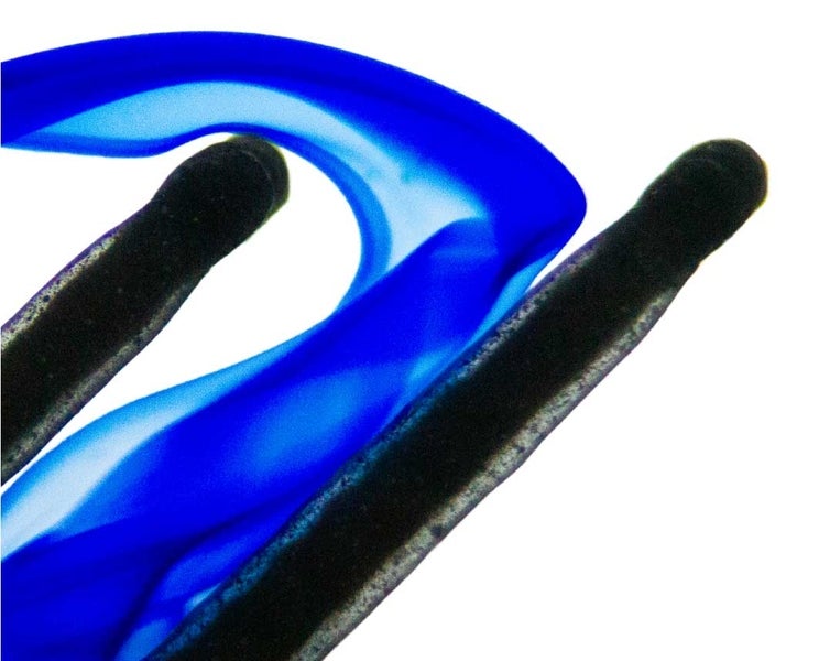 The blue liquid represents the flow structure between the filter plates in the experimental apparatus.