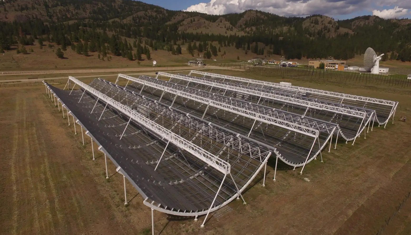 The CHIME array outside Penticton, British Columbia, is a novel radio telescope that has no moving parts. Designed to map hydrogen gas in the universe, it is also ideal for detecting fast radio bursts.