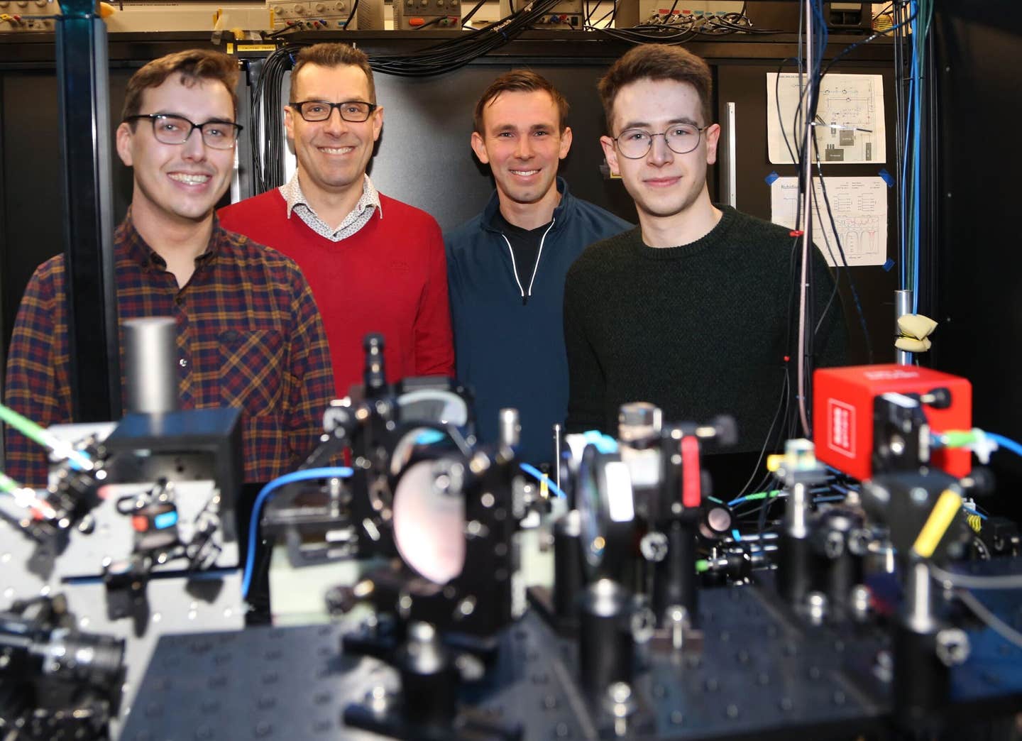 The Tweezer Team at Durham University and their experimental apparatus. From left: Dr Daniel Ruttley, Prof. Simon Cornish, Dr Alexander Guttridge and Mr Tom Hepworth.