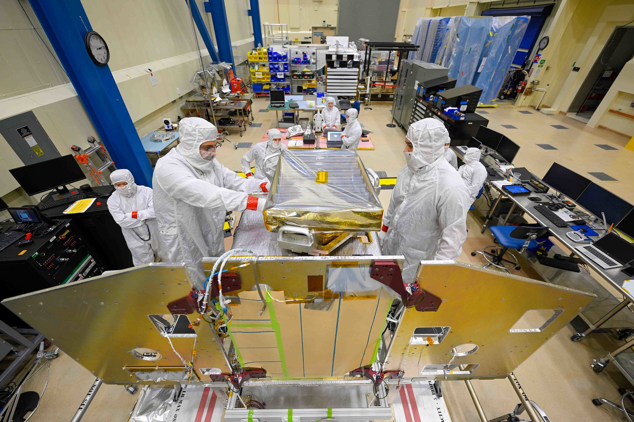 Lockheed Martin engineers installing NASA JPL’s High-resolution Volatiles and Minerals Moon Mapper (HVM3) – a spectrometer that measures infrared light absorbed by water – on the Lunar Trailblazer spacecraft. NASA’s Lunar Trailblazer mission will map water content on the Moon.