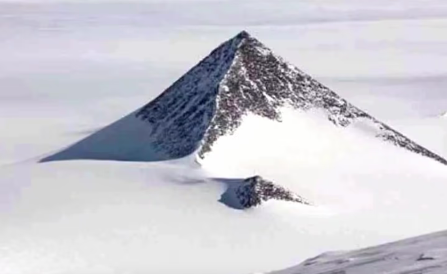 Buried beneath layers of dense frost in the Ellsworth Mountains, this supposed pyramid has fueled a storm of speculation.