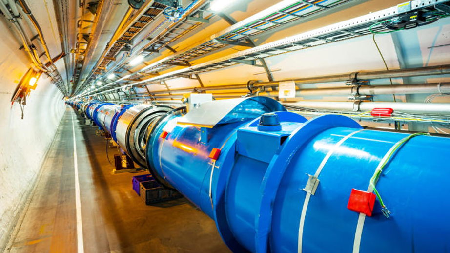 The LHC is 54 million times longer than the vaccum tube of the nanophotonic electron accelerator. 