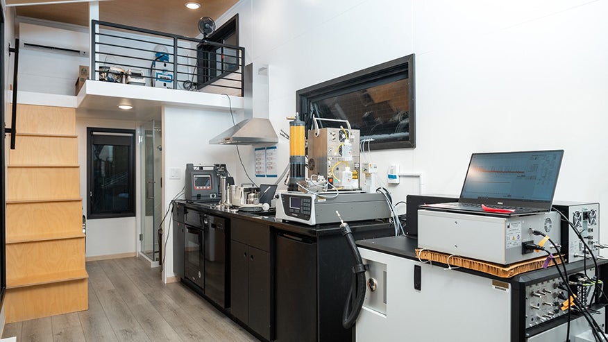 The inside of Purdue’s tiny house lab has various sensors and pieces of equipment to accurately and precisely measure pollutant emissions from common household activities in real time.