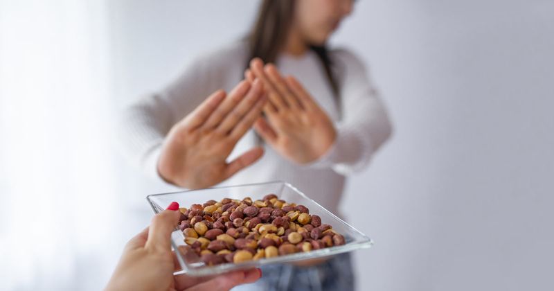 Traditional management of peanut allergies involves strict avoidance