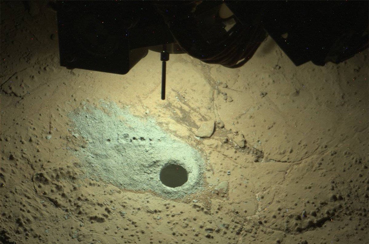 Samples drilled from the dried bed of an ancient martian lake have yielded chemical hints of past life. 