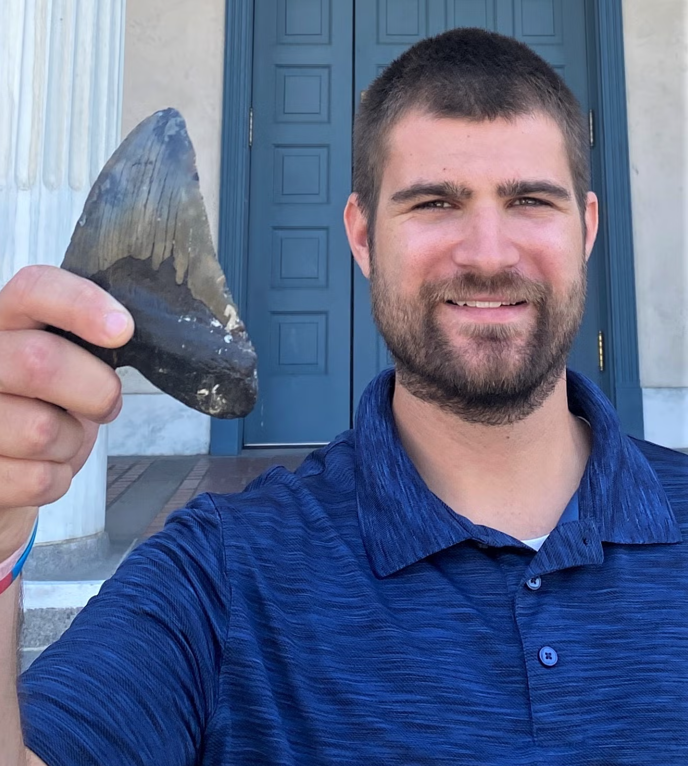 UCR biologist and study co-author Phillip Sternes with a megalodon tooth. 