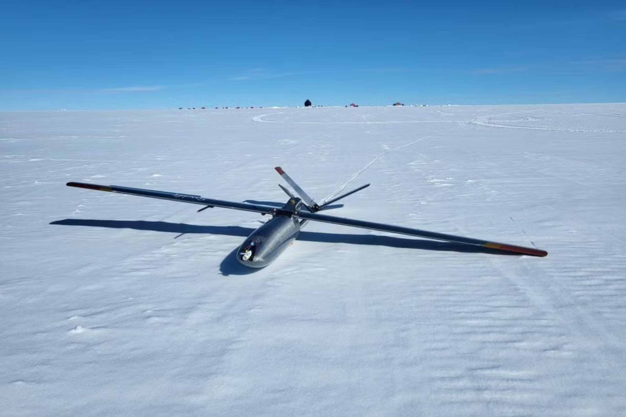 A drone landed on the Greenland snow surface at EastGRIP.