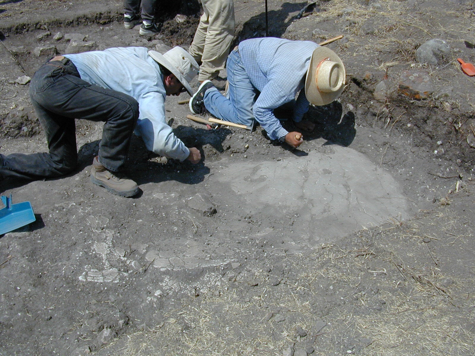 Gary Feinman and a crew member exposing a plaster floor on Terrace 925 in El Palmillo.