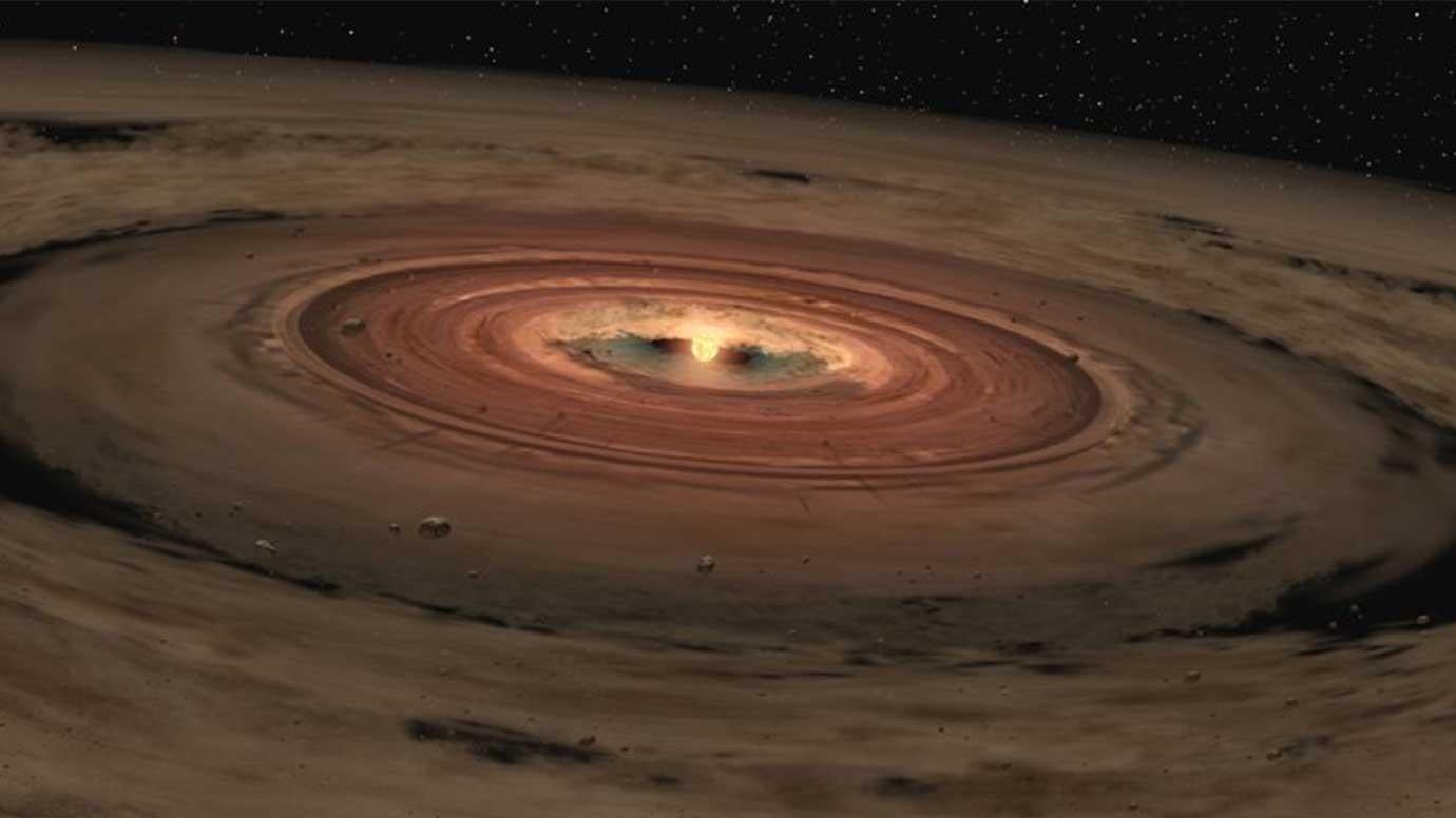 This artist's concept shows a very young star encircled by a disk of gas and dust, the raw materials from which rocky planets such as Earth are thought to form.