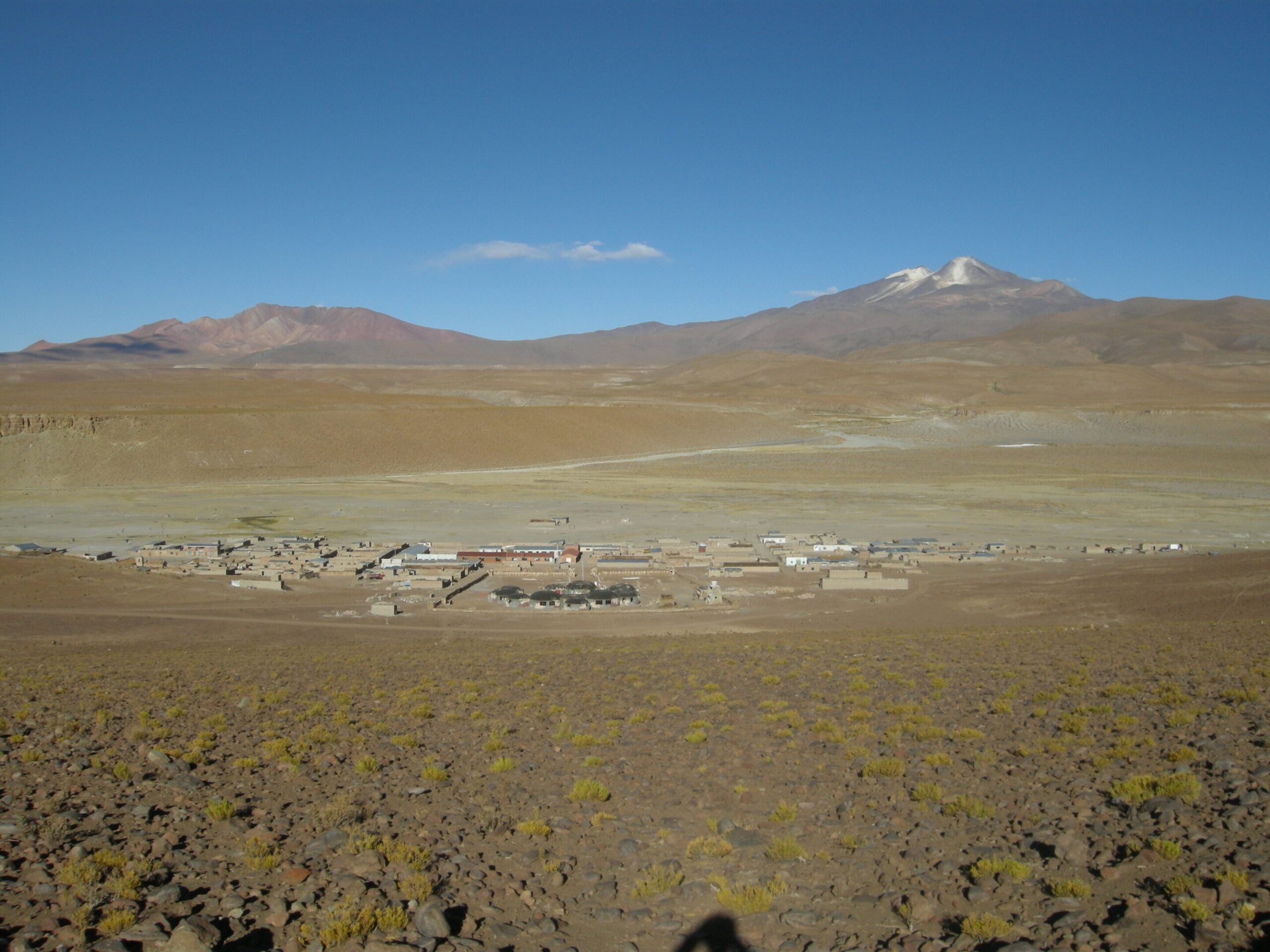 Cerro Uturuncu, right, and Cerro San Antonio, left, volcanoes above the small town of Quetena Chico on the Bolivian Altiplano.