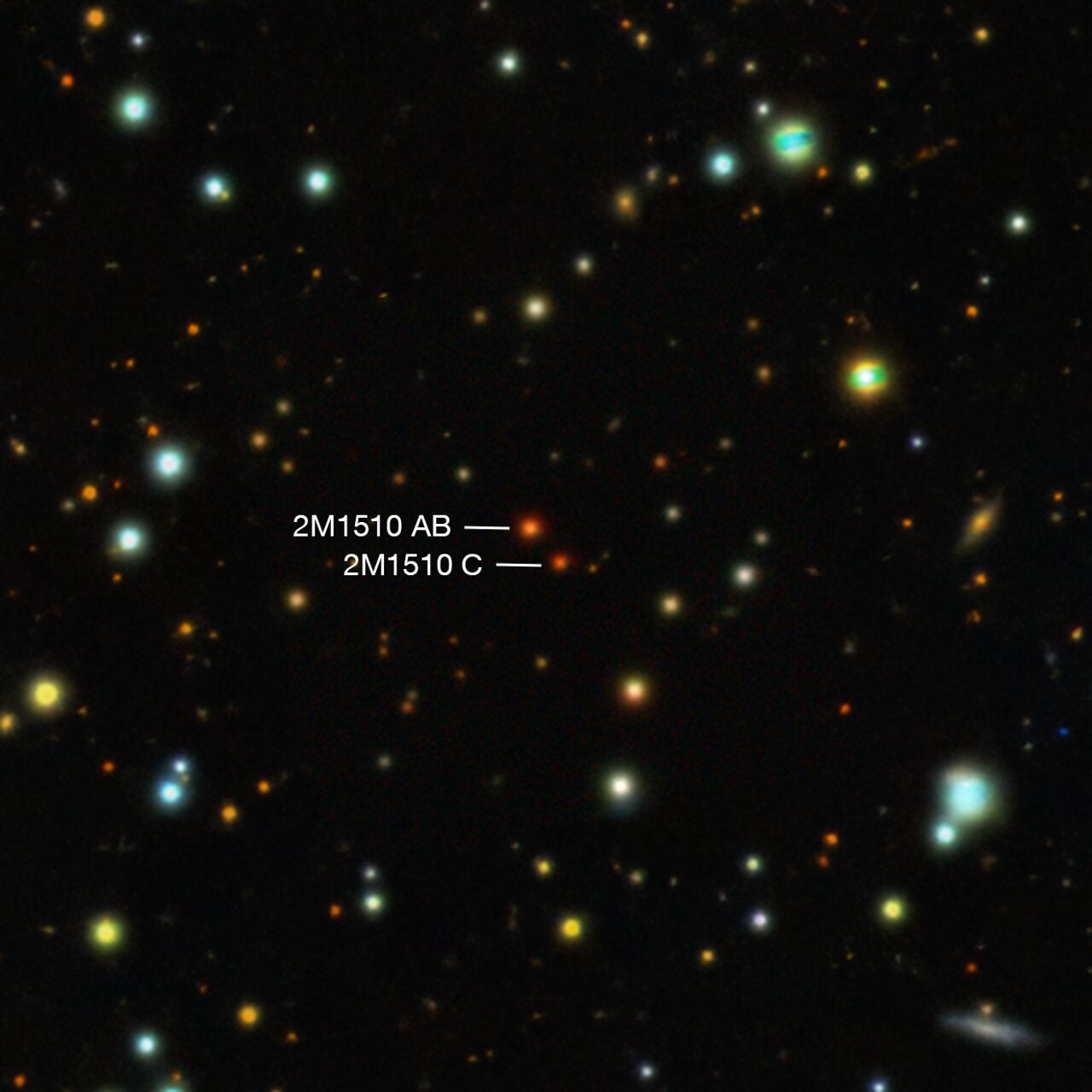 This illustration shows an exoplanet orbiting around two brown dwarfs –– objects bigger than gas-giant planets but too small to be proper stars.