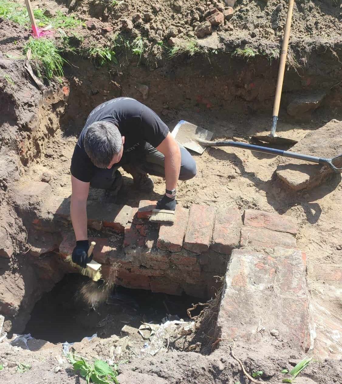 Member of the archeological team working within one of the excavation sites on the castle grounds. 