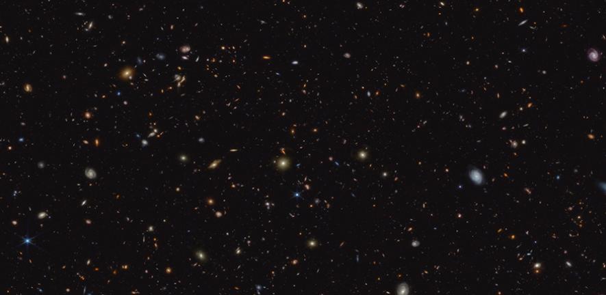Deep galaxy field, featuring thousands of galaxies of various shapes and sizes. 