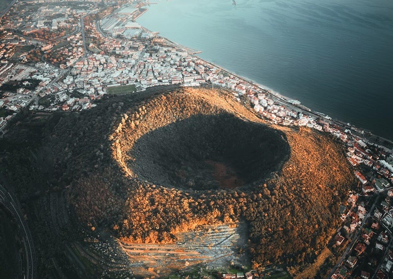 The Phlegraean Fields is a large volcanic caldera west of Naples, Italy. The Phlegraean Fields is a large volcanic caldera west of Naples, Italy.