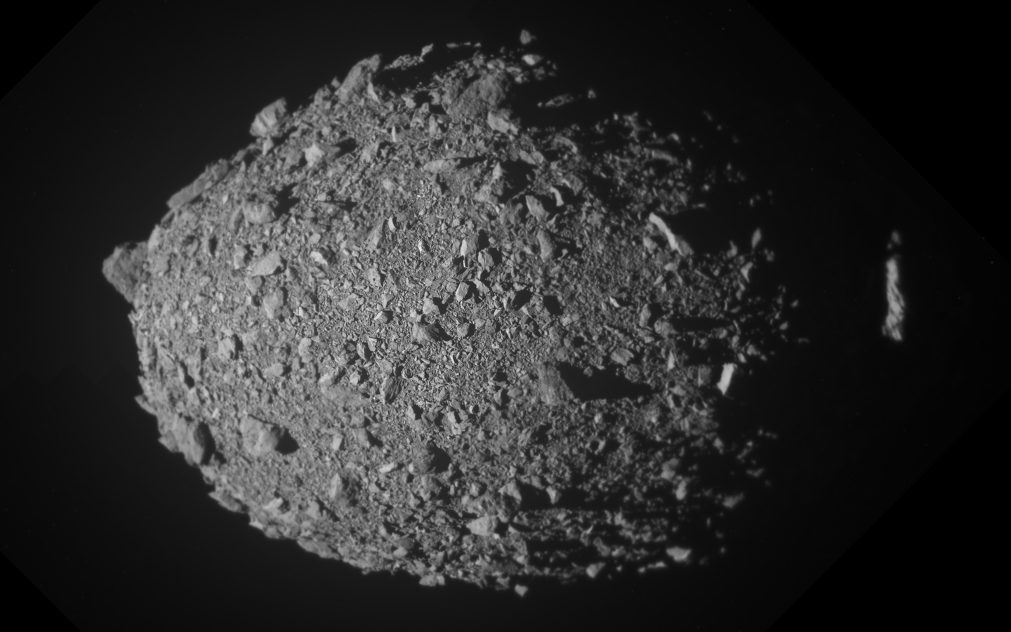 Asteroid Dimorphos. NASA’s DART mission proved it could shift an asteroid’s orbit, but new findings reveal ejected boulders added surprising momentum and complexity.