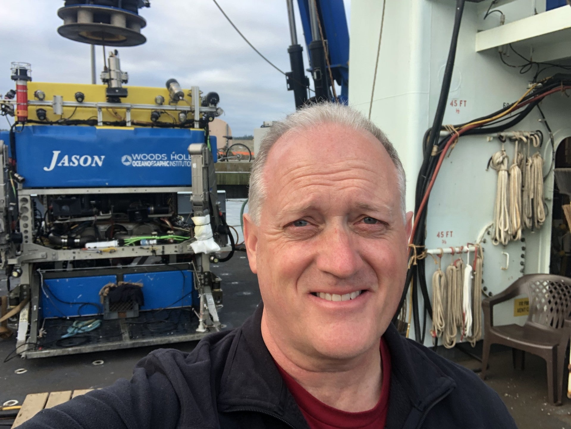 UMass Amherst microbiologist James Holden readying the submarine that will travel to the ocean’s floor in search of microbial life.