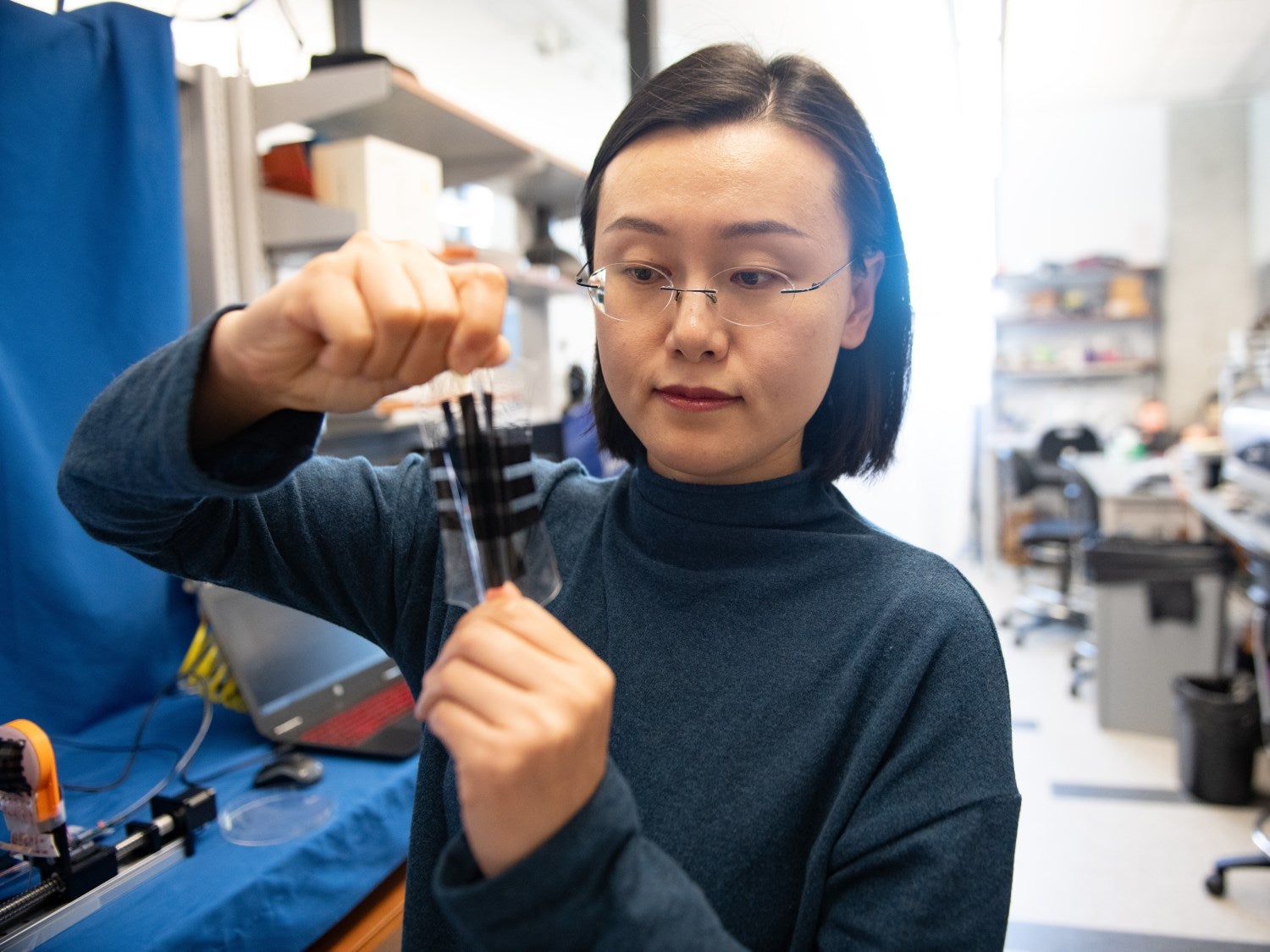 Nanshu Lu holding the hydration sensor.