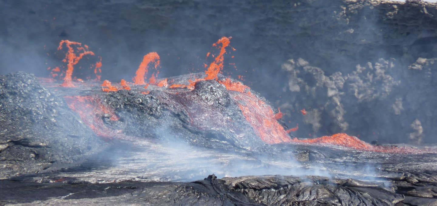 Molten mantle pulses under Afar, shaping volcanoes and tearing Africa apart to form a new ocean.