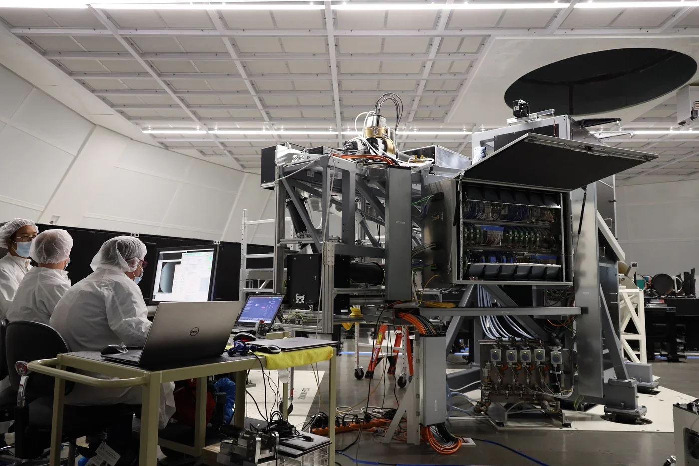 NSO and KIS engineers and scientists work on the Visible Tunable Filter (VTF) inside the Coudé Lab at the Inouye Solar Telescope, preparing the instrument for its first light.