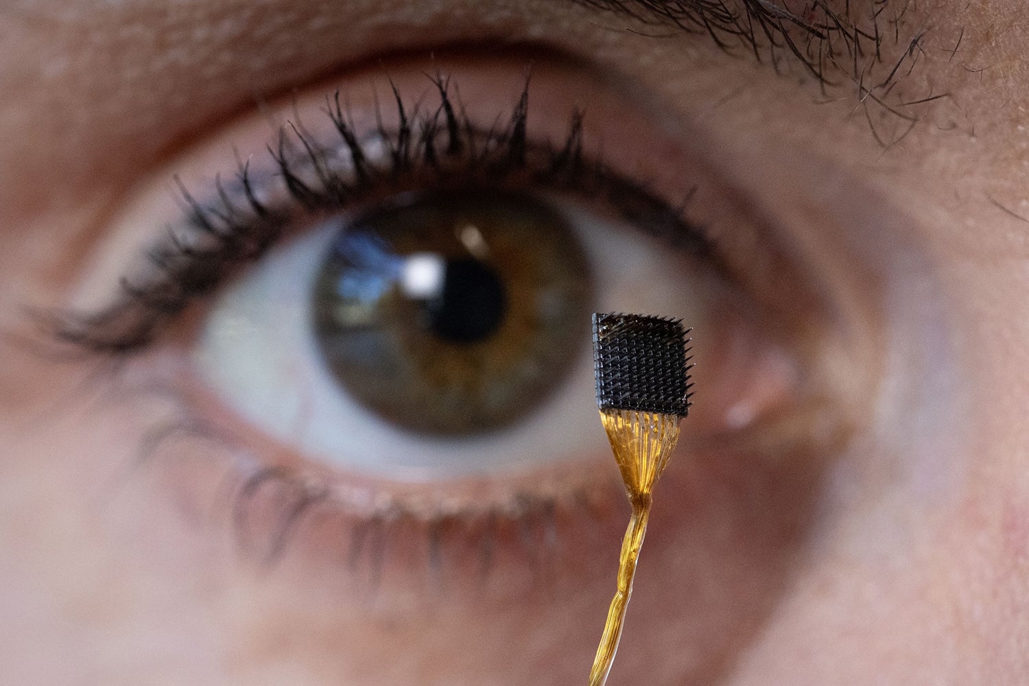Erin Kunz holds a microelectrode array in the Clark Center, Stanford University. The array is implanted in the brain to collect data.