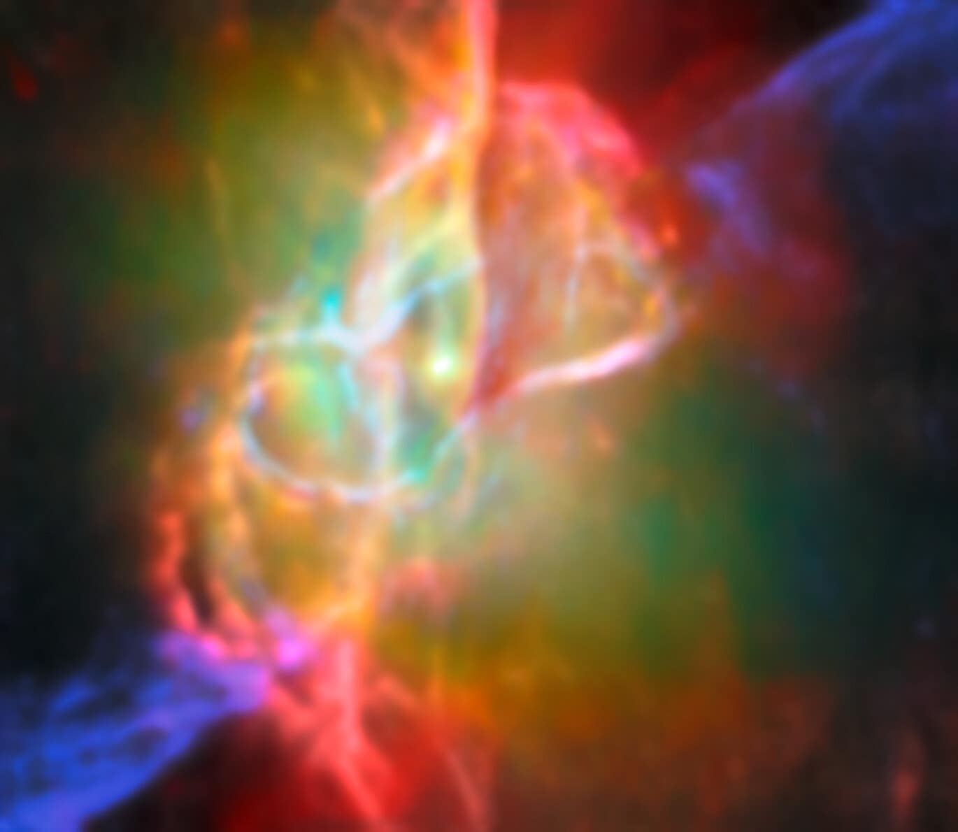 The complicated structure at the centre of the Butterfly Nebula, NGC 6302. There is a bright source at the centre that is surrounded by greenish nebulosity and several looping lines in cream, orange and pink.