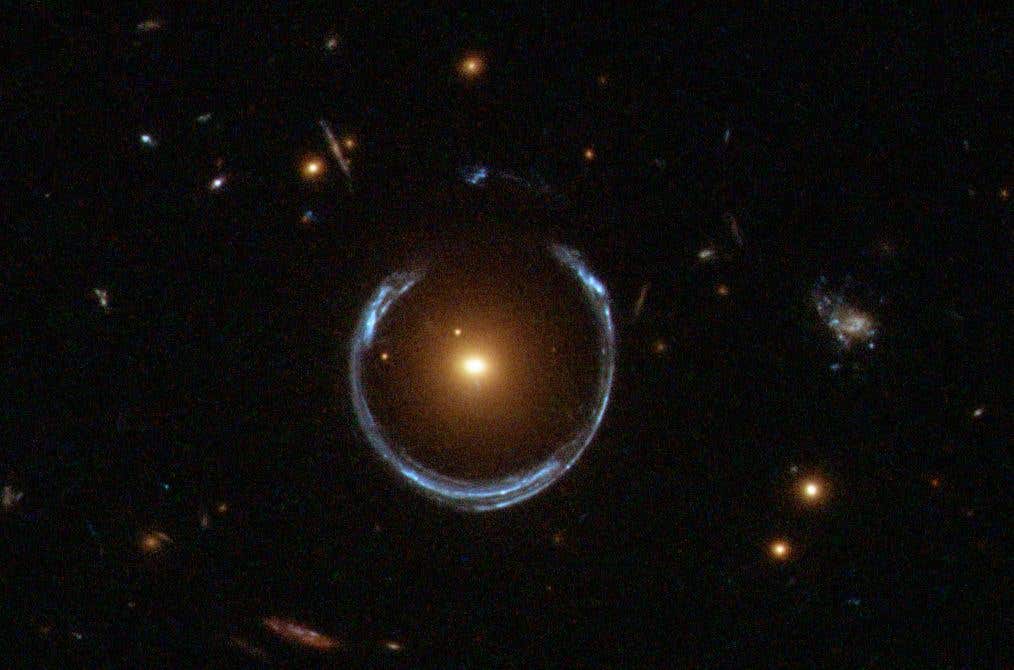 In a landmark result, astronomers used gravitational lensing and stellar dynamics to weigh a dormant black hole in the Cosmic Horseshoe at 36 billion solar masses