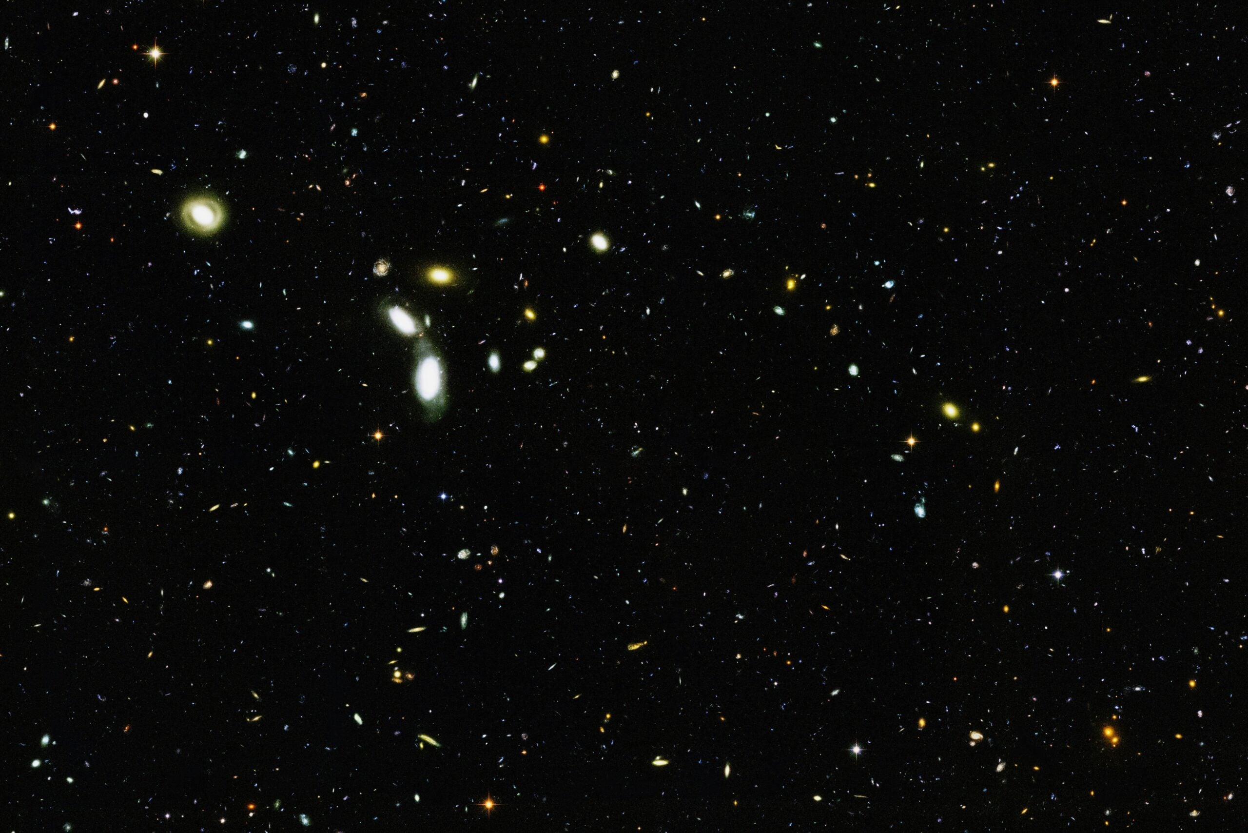 Observations have hinted at an unseen cosmic component: galaxies rotate faster than their visible mass allows, galaxy clusters warp light beyond predictions, and the structure of the early universe only fits if most matter is invisible.