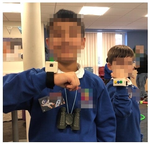 Picture of A3 and N1 wearing the bracelets during the indoor session