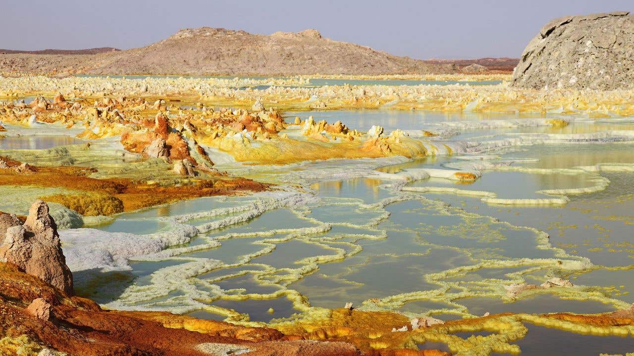 A new study uncovers how amino acids could have linked with RNA under early Earth conditions, shedding light on the origin of life.