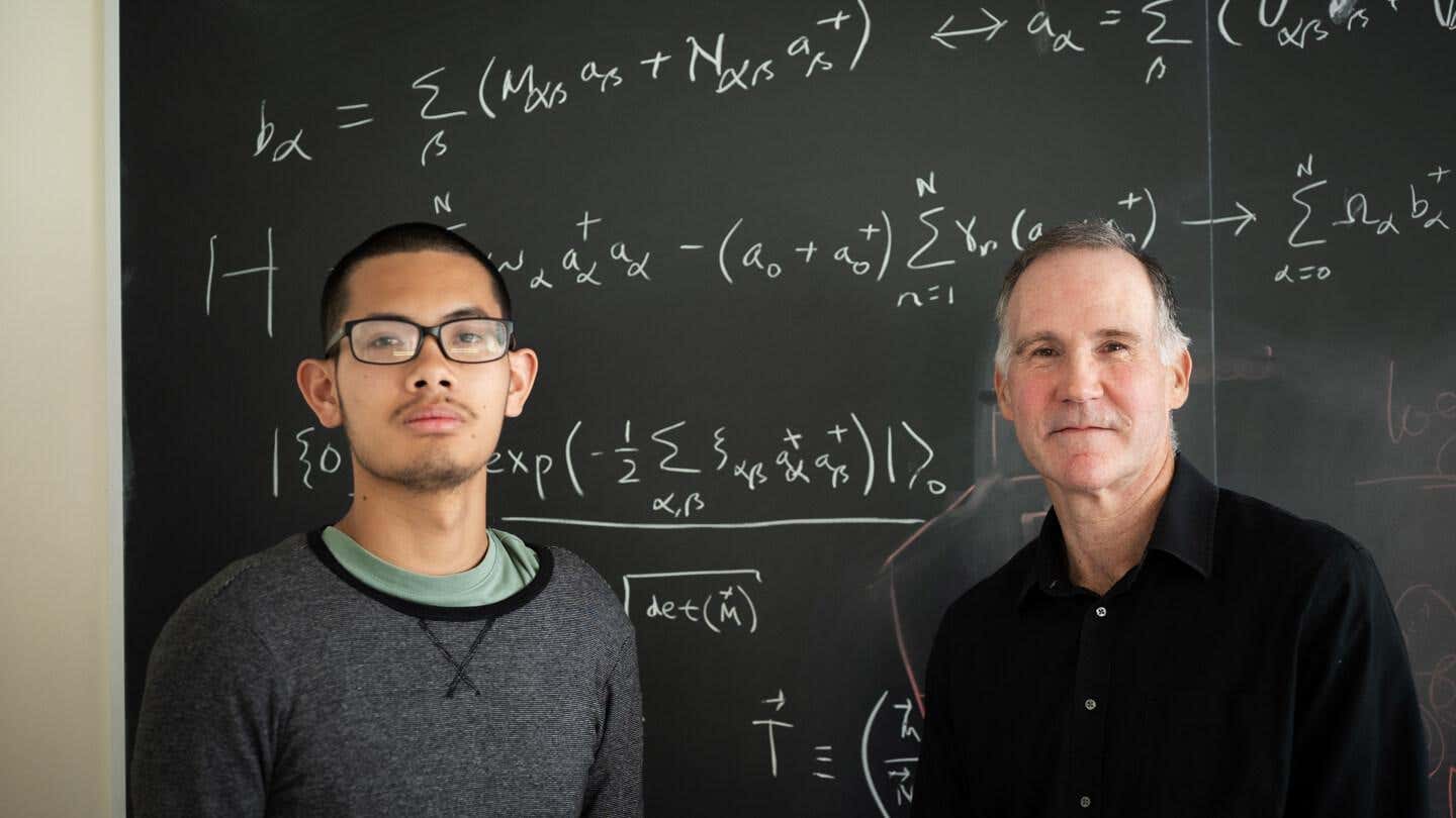 University of Vermont professor Dennis Clougherty (right) and his student Nam Dinh