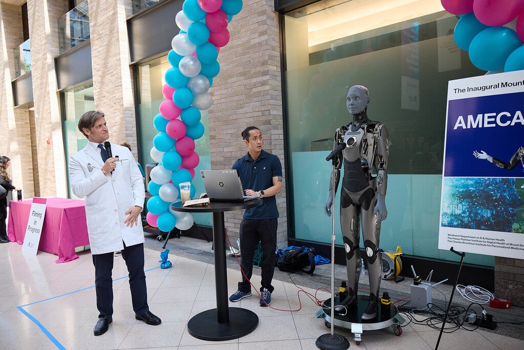 At the Mount SinAI Retreat, Alex Charney interviewed Ameca (created by Engineered Arts), the world's most advanced humanoid robot, in a captivating live demonstration that showcased her lifelike expressions and ability to engage with humans through conversation. Their exchange highlighted the promise of human–AI interaction and embodied the retreat's bold vision for the future of AI in healthcare.