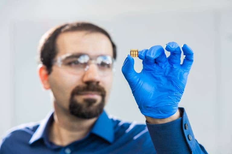 Associate Professor Mojtaba Abdi-Jalebi with a small prototype of photovoltaic cells optimized for indoor light.