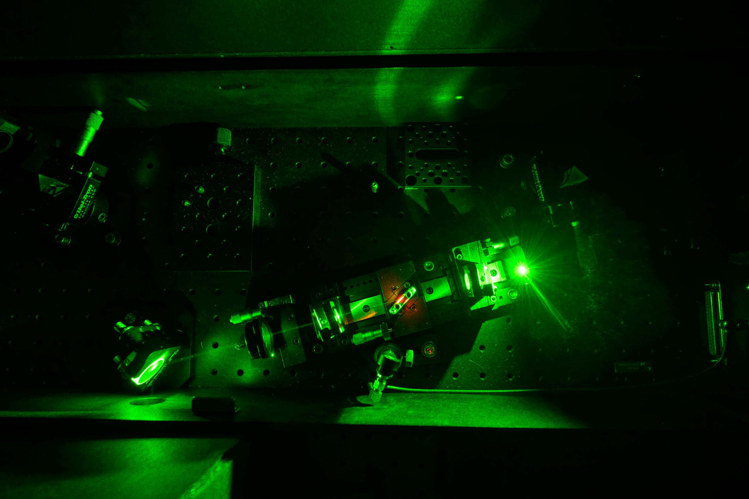 A laser oscillator used to generate light pulses for etching nanostructures onto thermoelectric generators is pictured in the lab of University of Rochester Institute of Optics professor Chunlei Guo. 