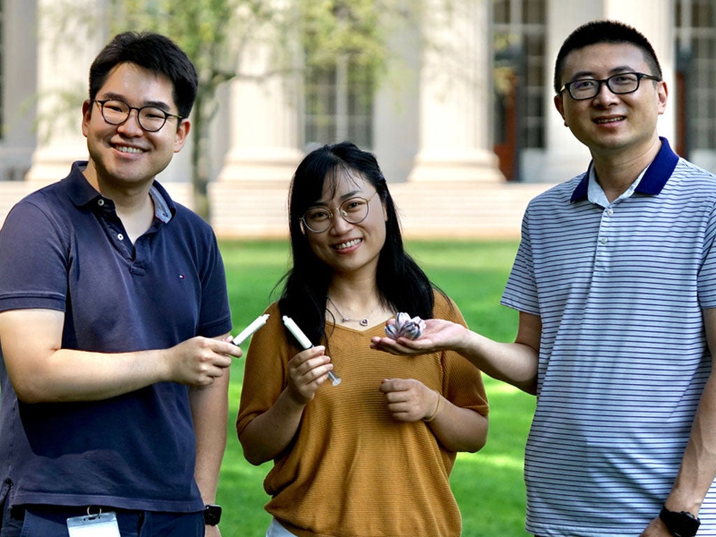 The research team: Hyunwoo Yuk, Jingjing Wu, and Xuanhe Zhao (from left to right), holding the barnacle shell and the barnacle-glue-inspired hemostatic paste in hands.