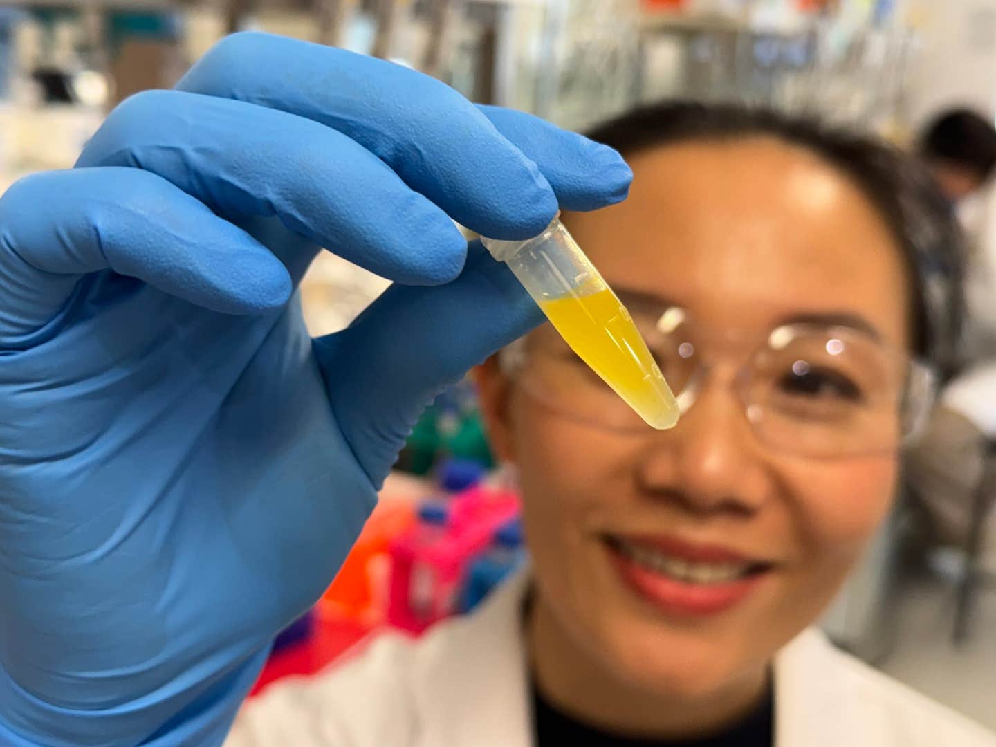 Dr Dao Nguyen examines a vial of lutein formulation developed for potential use in eyedrop treatments.